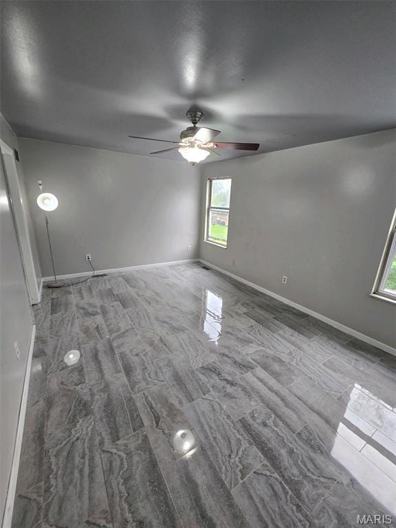 352 Sturbridge Village Dr, Hazelwood, MO 63042 - empty room with ceiling fan and baseboards