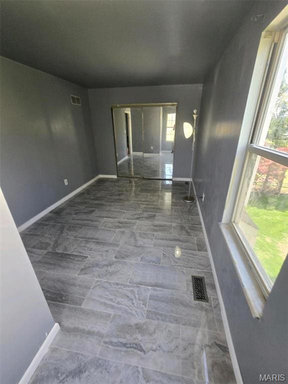 352 Sturbridge Village Dr, Hazelwood, MO 63042 - empty room with baseboards and marble finish flooring