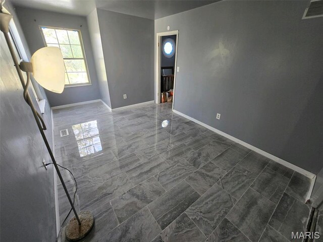 352 Sturbridge Village Dr, Hazelwood, MO 63042 - unfurnished room with baseboards and dark marble finish flooring