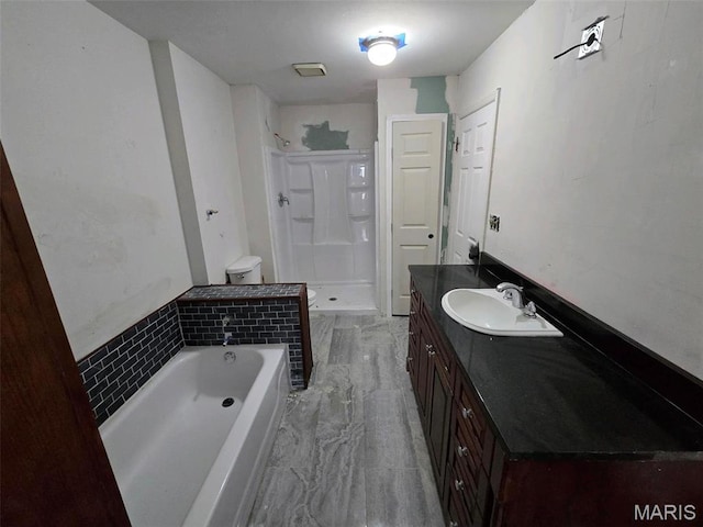 352 Sturbridge Village Dr, Hazelwood, MO 63042 - bathroom with marble look tile flooring, a stall shower, vanity, and a garden tub
