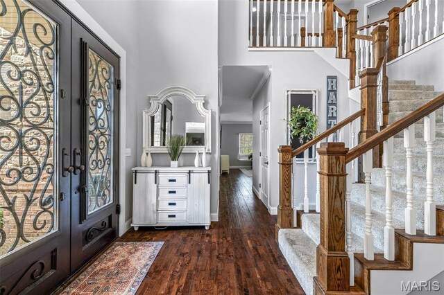 312 Oak Forest Dr, Jackson, MO 63755 - entryway featuring french doors, dark wood finished floors, baseboards, a high ceiling, and stairway