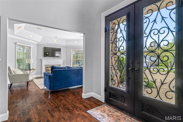 312 Oak Forest Dr, Jackson, MO 63755 - entrance foyer with french doors, a raised ceiling, baseboards, hardwood / wood-style flooring, and a premium fireplace