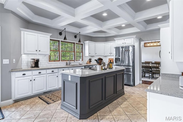 312 Oak Forest Dr, Jackson, MO 63755 - kitchen with stainless steel refrigerator with ice dispenser, a sink, white cabinets, tasteful backsplash, and beam ceiling