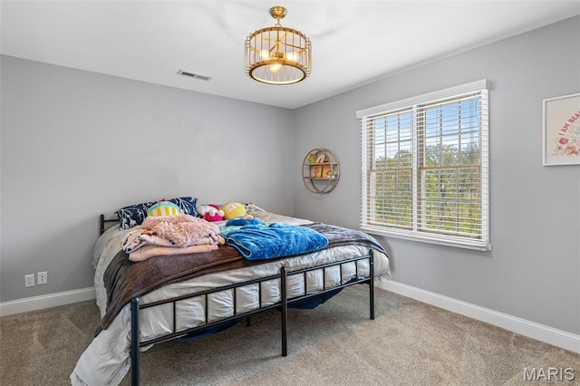 312 Oak Forest Dr, Jackson, MO 63755 - carpeted bedroom featuring a chandelier and baseboards