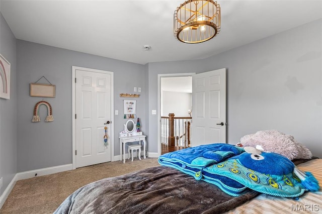 312 Oak Forest Dr, Jackson, MO 63755 - carpeted bedroom with baseboards and a chandelier
