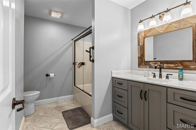 312 Oak Forest Dr, Jackson, MO 63755 - bathroom featuring toilet, baseboards, enclosed tub / shower combo, and vanity