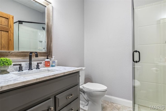 312 Oak Forest Dr, Jackson, MO 63755 - bathroom featuring a shower stall, baseboards, toilet, and vanity