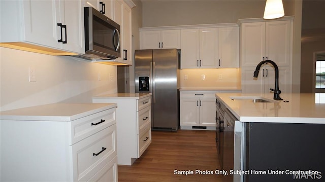 2028 Ravenel, Swansea, IL 62226 - kitchen featuring appliances with stainless steel finishes, a sink, light countertops, wood finished floors, and white cabinets