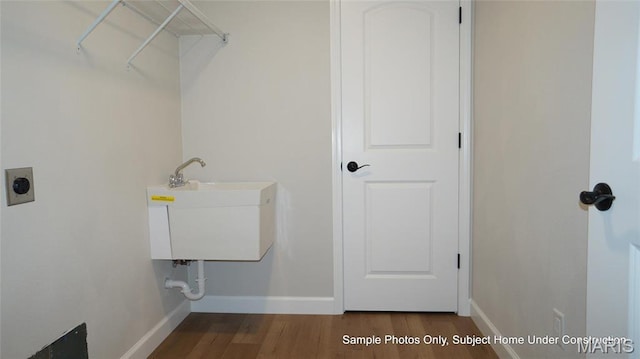 2028 Ravenel, Swansea, IL 62226 - clothes washing area featuring hookup for an electric dryer, baseboards, and wood finished floors