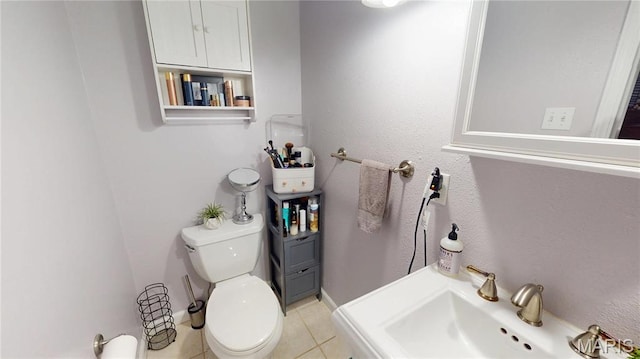 311 S Hibbard St, Staunton, IL 62088 - bathroom with a sink, tile patterned flooring, and toilet