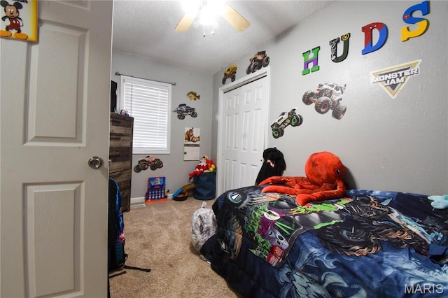 311 S Hibbard St, Staunton, IL 62088 - bedroom with carpet, a textured ceiling, a closet, and ceiling fan
