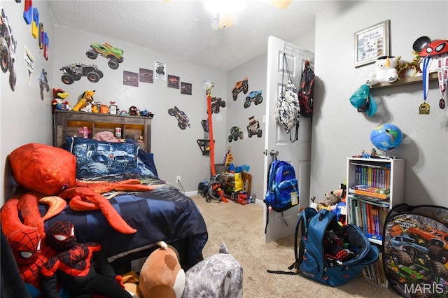 311 S Hibbard St, Staunton, IL 62088 - bedroom with carpet flooring, a textured ceiling, and a ceiling fan