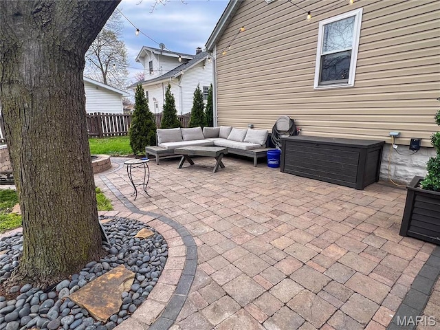 311 S Hibbard St, Staunton, IL 62088 - view of patio / terrace with an outdoor living space with a fire pit and fence