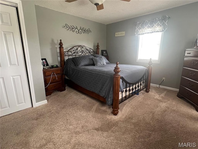 311 S Hibbard St, Staunton, IL 62088 - bedroom with light colored carpet, a textured ceiling, and ceiling fan