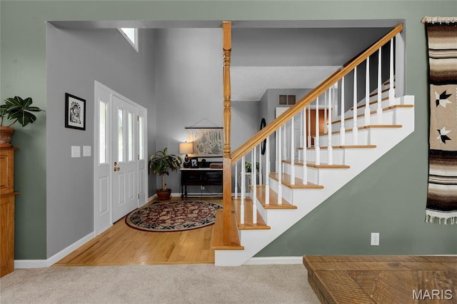 22 Whispering Oaks Dr, Washington, MO 63090 - carpeted entrance foyer with stairs and baseboards