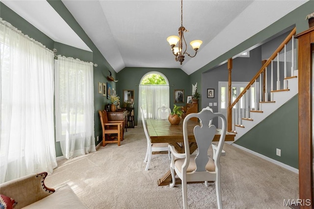 22 Whispering Oaks Dr, Washington, MO 63090 - carpeted dining area with lofted ceiling, a chandelier, stairs, and baseboards