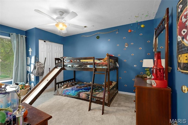 22 Whispering Oaks Dr, Washington, MO 63090 - bedroom with carpet floors, a ceiling fan, a closet, and baseboards