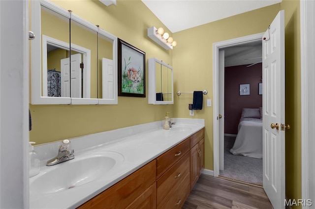 22 Whispering Oaks Dr, Washington, MO 63090 - ensuite bathroom featuring double vanity, wood finished floors, and baseboards