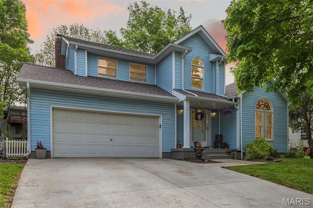 22 Whispering Oaks Dr, Washington, MO 63090 - view of front of home with driveway, a garage, covered porch, and a chimney