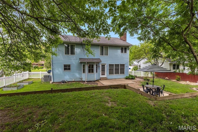 22 Whispering Oaks Dr, Washington, MO 63090 - rear view of property featuring a patio, a chimney, and a garden