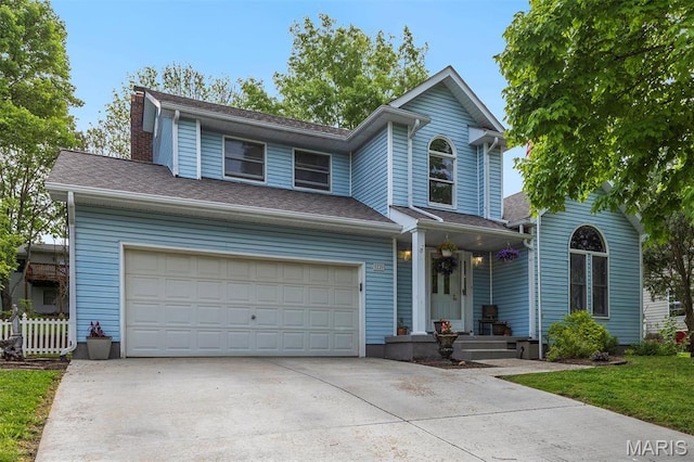 22 Whispering Oaks Dr, Washington, MO 63090 - view of front of house with driveway, a chimney, and a garage