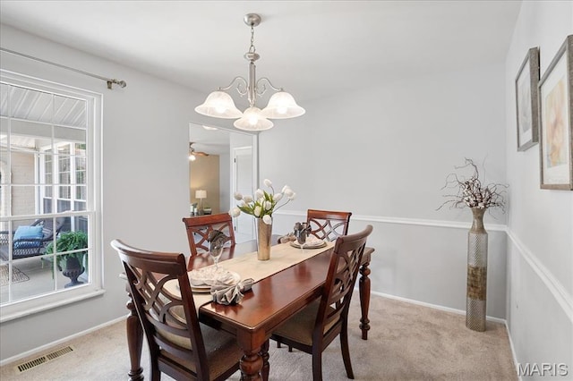 1115 Pinrun Dr, Ballwin, MO 63011 - dining room with a chandelier, light carpet, and baseboards