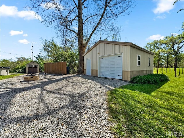 detached garage featuring driveway