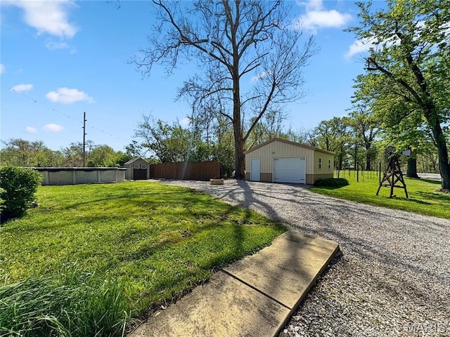view of property exterior with an outbuilding, driveway, and a detached garage