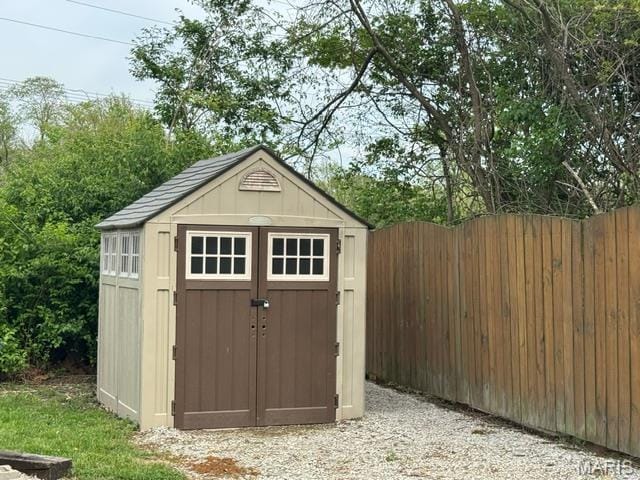 view of shed with fence