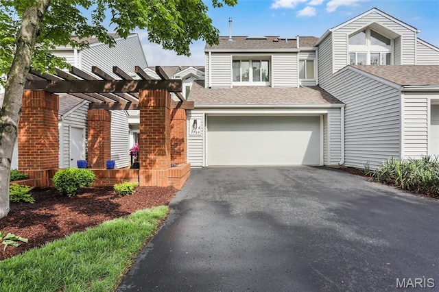 1709 Highview Circle Ct, Ballwin, MO 63021 - townhome / multi-family property with asphalt driveway, a garage, roof with shingles, and a pergola