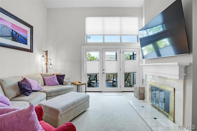 1709 Highview Circle Ct, Ballwin, MO 63021 - living room featuring a tiled fireplace, carpet, and a high ceiling