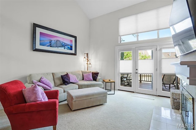 1709 Highview Circle Ct, Ballwin, MO 63021 - living room with a fireplace, healthy amount of natural light, carpet flooring, high vaulted ceiling, and french doors