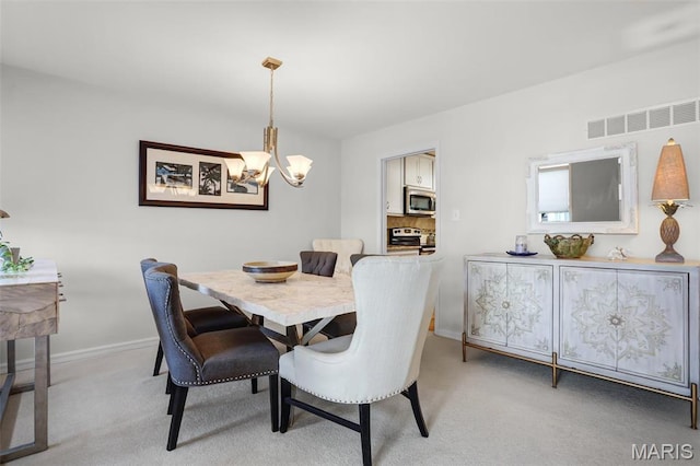 1709 Highview Circle Ct, Ballwin, MO 63021 - dining area with a chandelier, light colored carpet, and baseboards