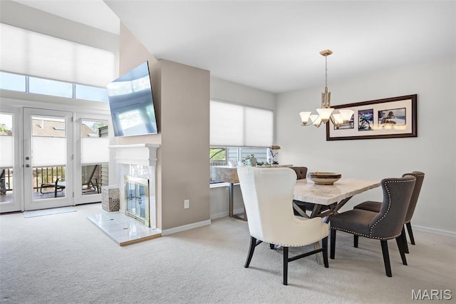 1709 Highview Circle Ct, Ballwin, MO 63021 - carpeted dining space with a chandelier, baseboards, and a tile fireplace