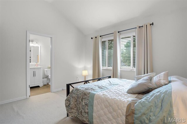 1709 Highview Circle Ct, Ballwin, MO 63021 - bedroom featuring light colored carpet, lofted ceiling, baseboards, and ensuite bath