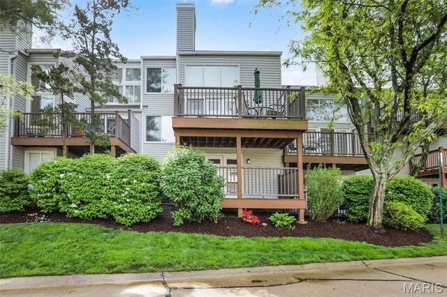 1709 Highview Circle Ct, Ballwin, MO 63021 - rear view of property featuring a chimney