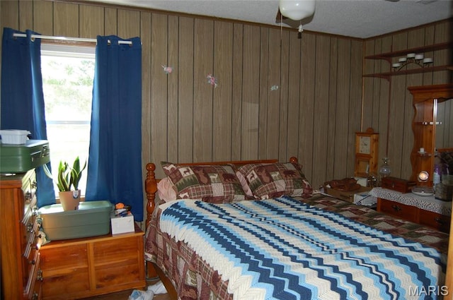 bedroom with wooden walls