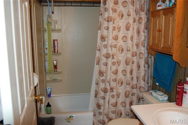 bathroom featuring toilet, shower / bath combo, and vanity