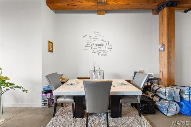dining space featuring baseboards