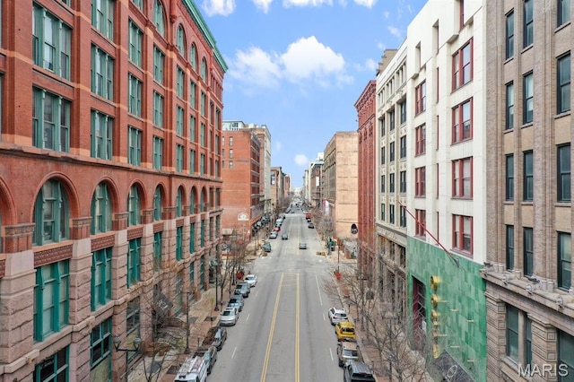 view of street featuring sidewalks and street lights