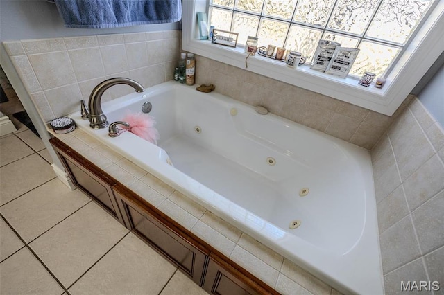 bathroom featuring a tub with jets and tile patterned flooring
