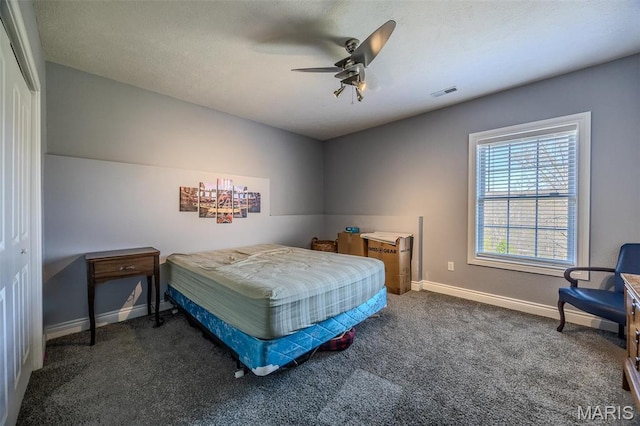 carpeted bedroom with baseboards and ceiling fan