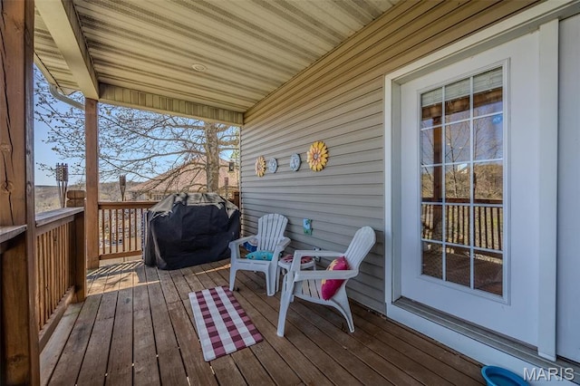 wooden deck with area for grilling