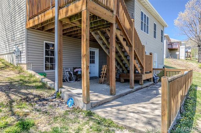 view of patio featuring a deck and stairs