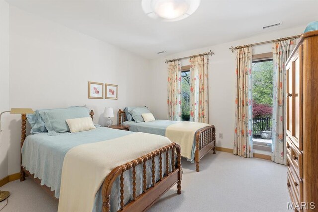 1406 W Adams, Kirkwood, MO 63122 - bedroom featuring baseboards, access to exterior, and light carpet