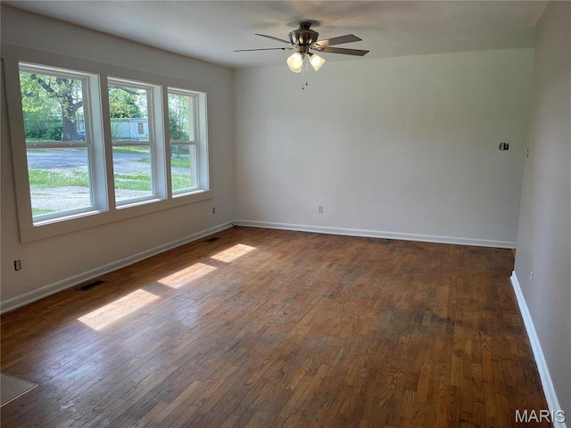 903 S Oak St, Salem, MO 65560 - unfurnished room featuring dark wood-style flooring, baseboards, and a ceiling fan