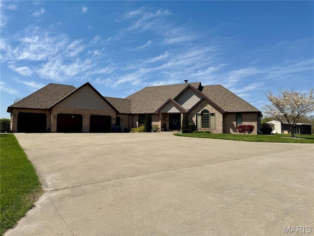 view of front facade featuring concrete driveway, an attached garage, brick siding, a shingled roof, and a front lawn