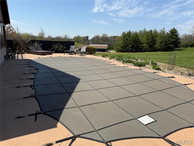 view of pool with a patio and a covered pool
