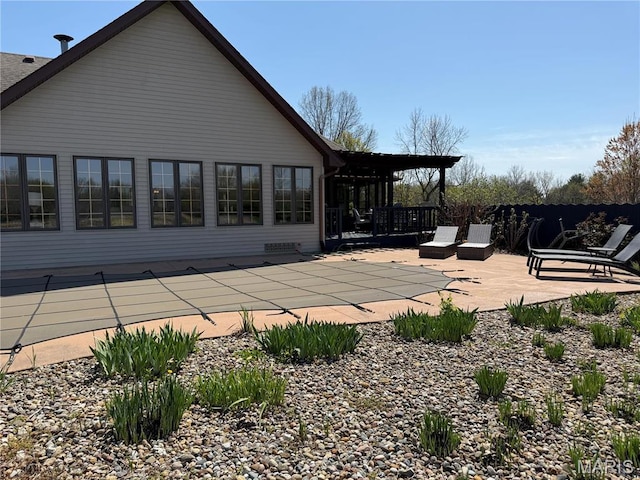 rear view of property featuring a patio