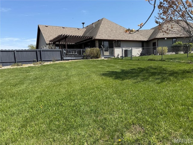 rear view of house with a pergola and a shingled roof